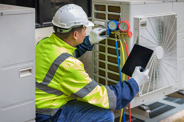 Professional Heat Pump Repair technician working in Delong, IN